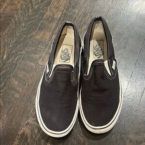 Vans Black and White Slip-On Sneakers